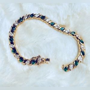 Gold tone faux emerald & faux diamond tennis bracelet